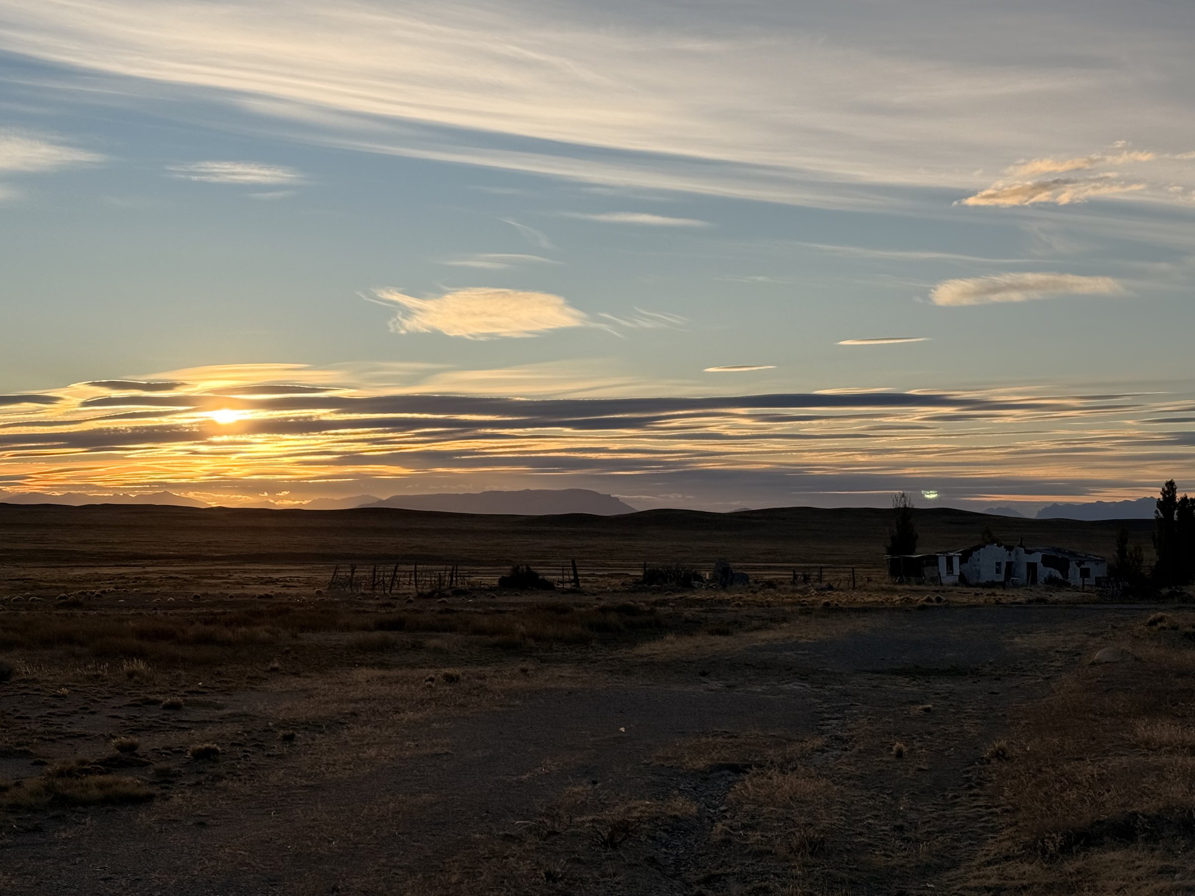 Sunset over an old homestead on the steppe near Don Adamo