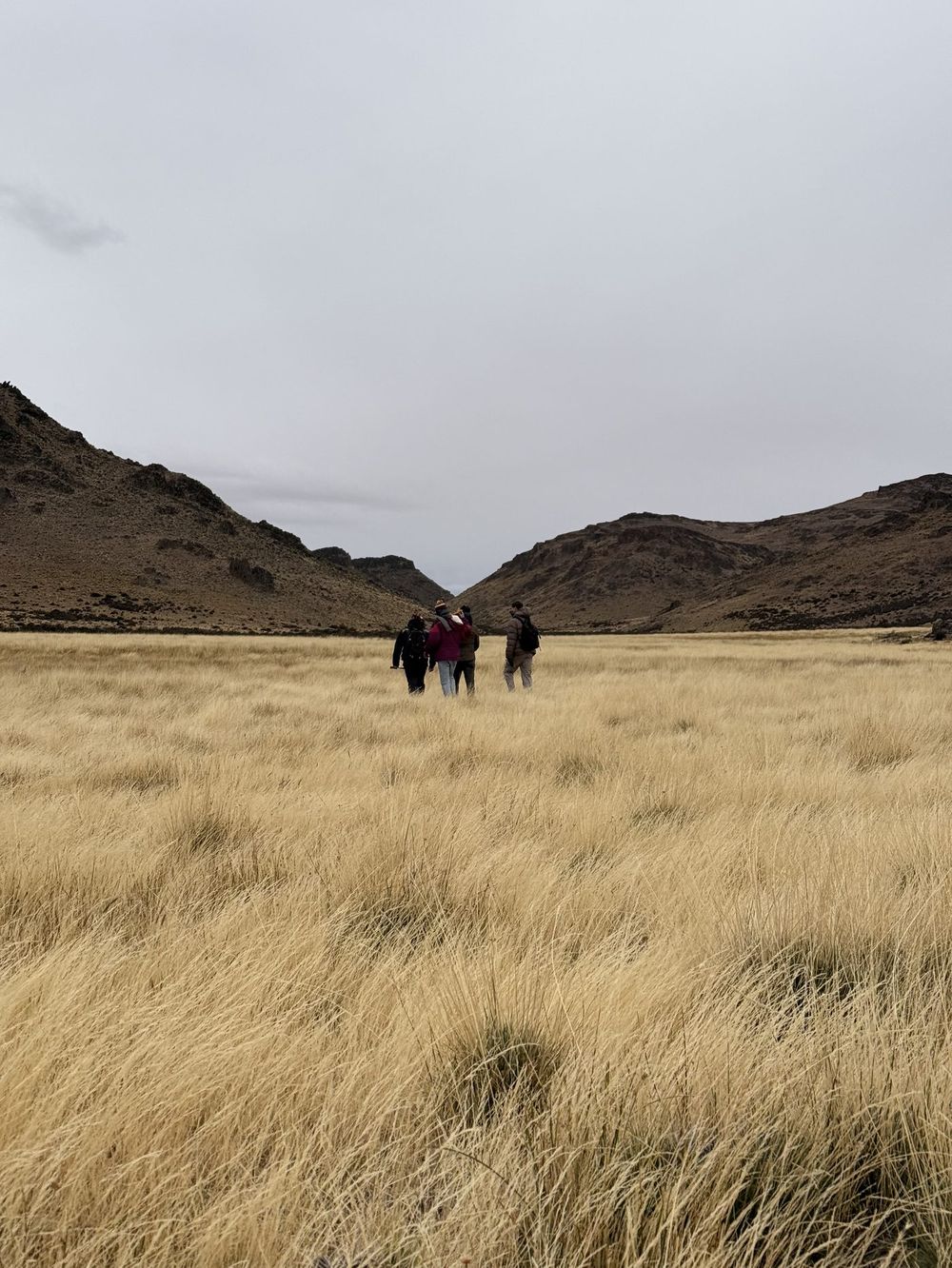 The Deseado Resources team walking across the Patagonian steppe